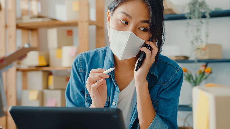 Woman talking to phone about Amazon